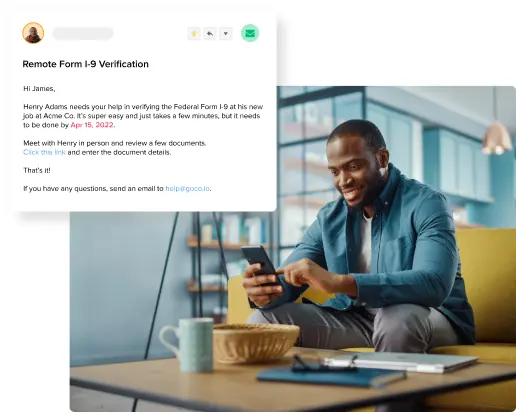 a man sitting on a couch using a phone