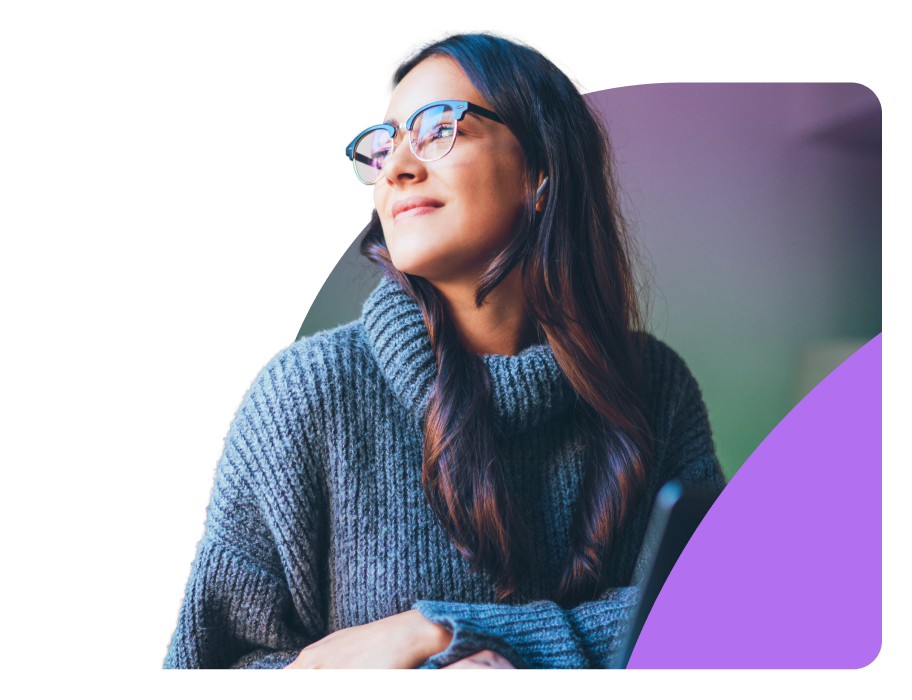 a woman wearing glasses and looking up at the sky