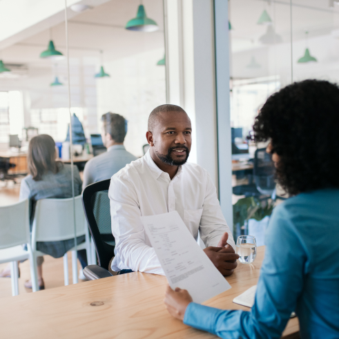 a man and woman sitting at a table