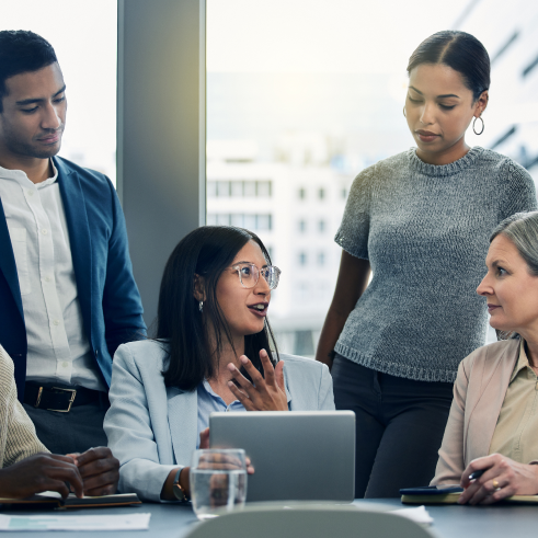 a group of people sitting around a table