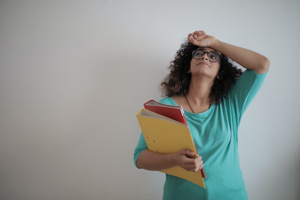 a woman holding a book and looking up
