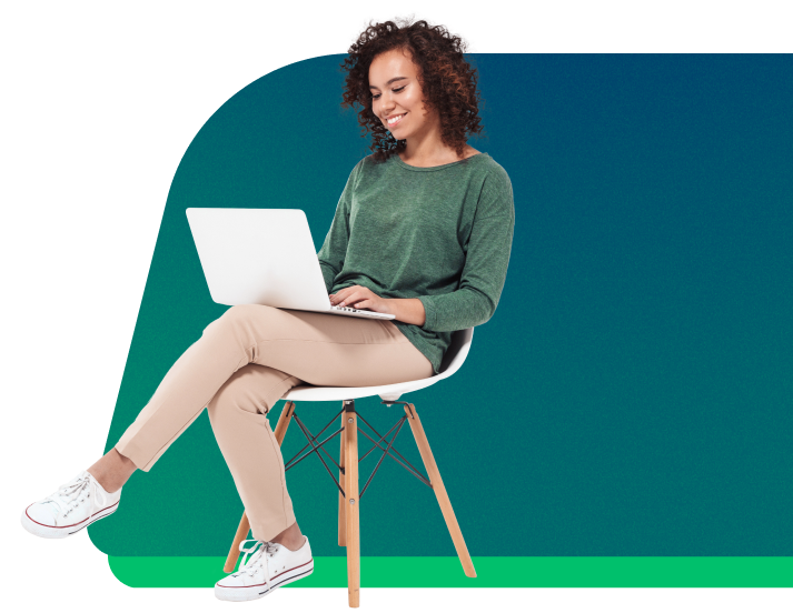 a woman sitting on a chair using a laptop