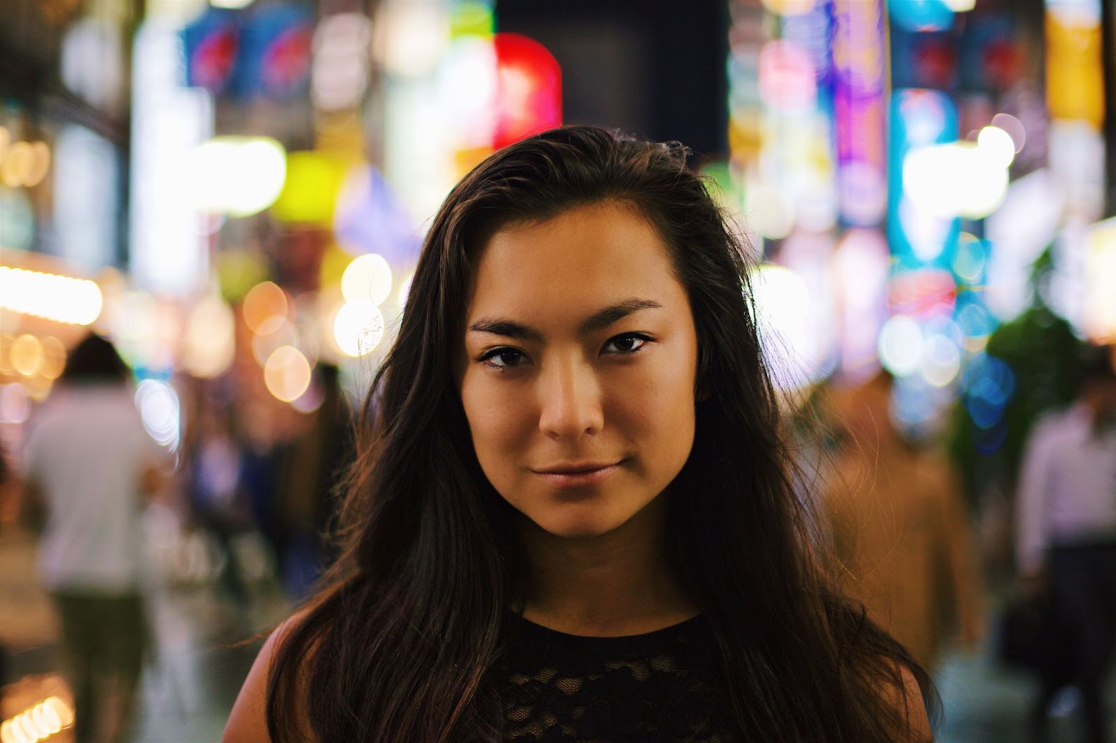 a woman standing in front of a crowd