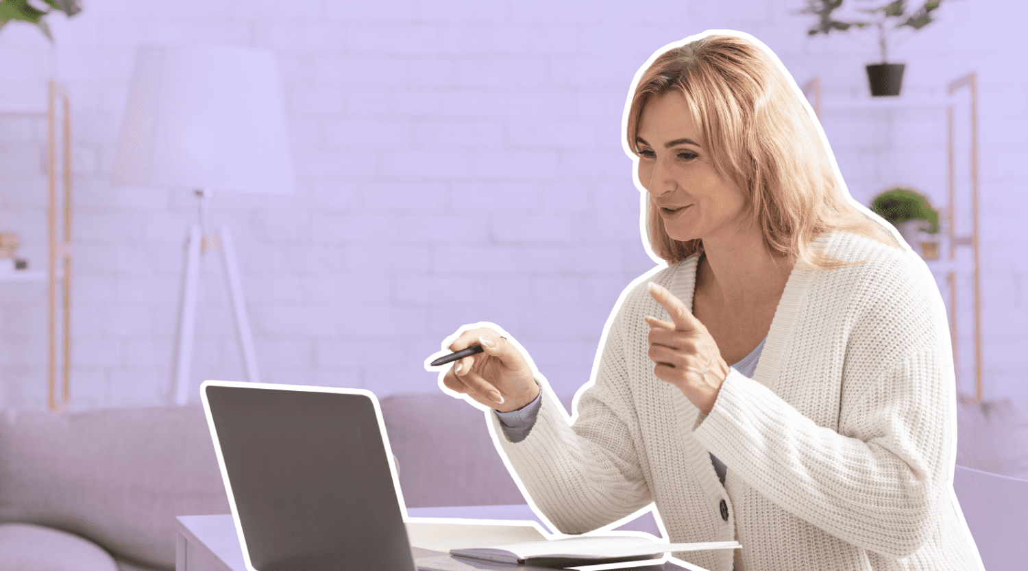 woman pointing at laptop