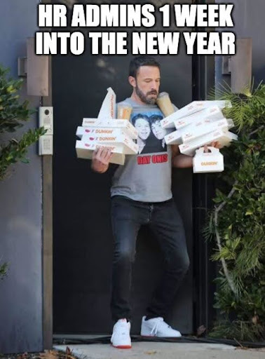 a man is holding boxes of pizza outside