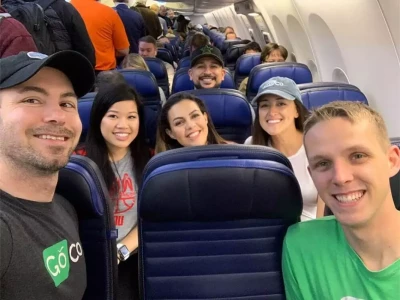 a group of people sitting on an airplane