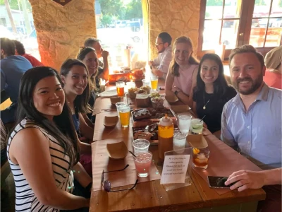 a group of people sitting at a table with drinks