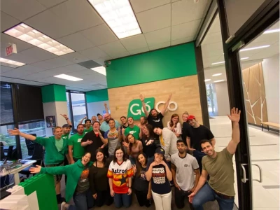 a group of people posing in an office