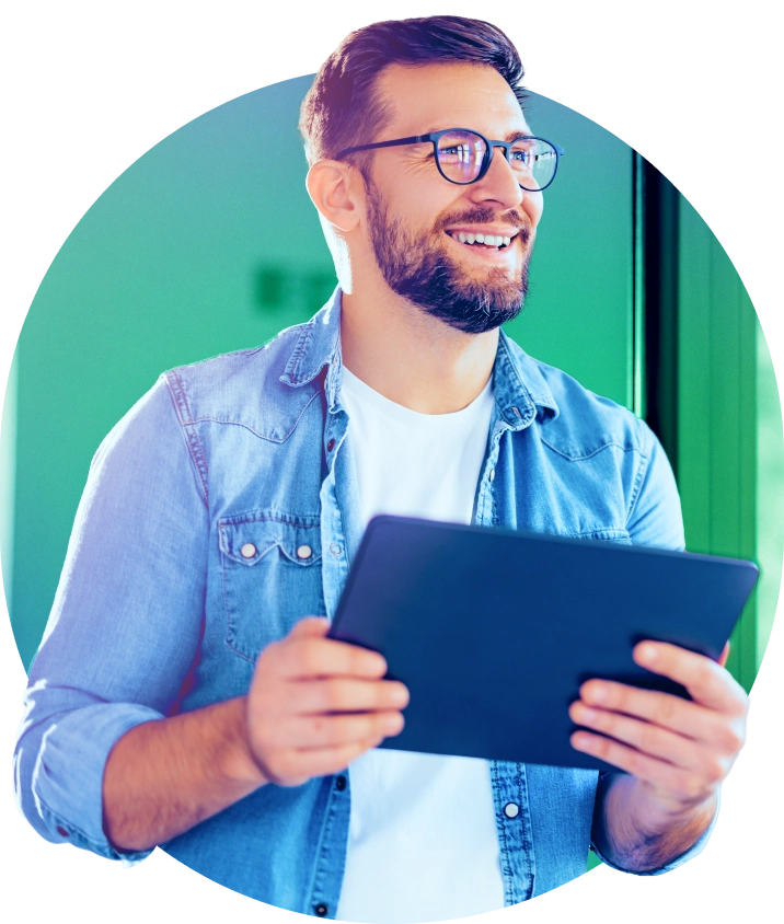 a man with glasses and a beard holding a tablet