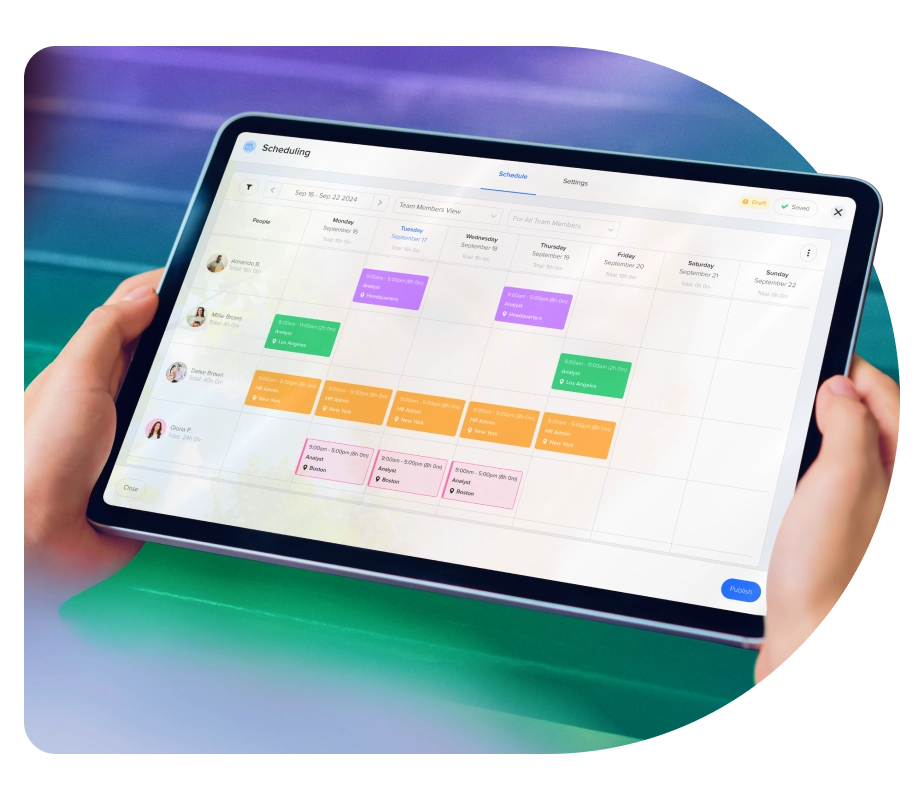a person holding a tablet with a calendar on it