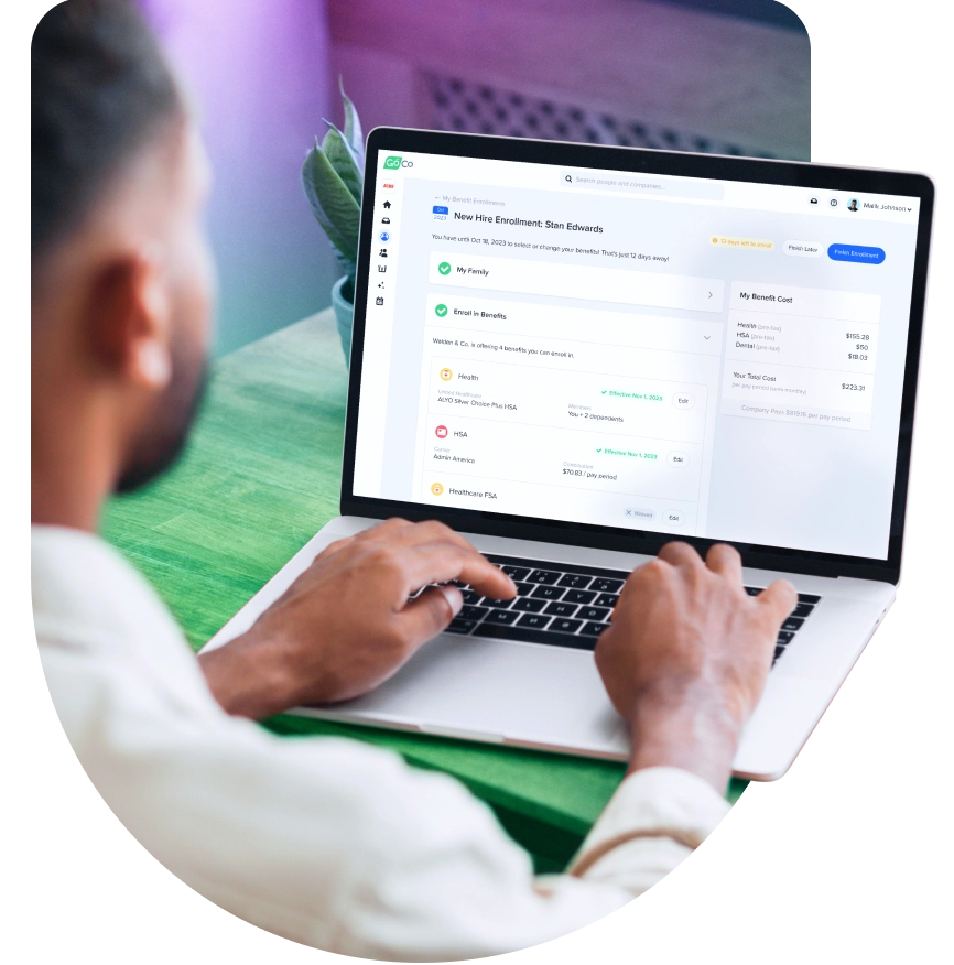 a man is typing on a laptop