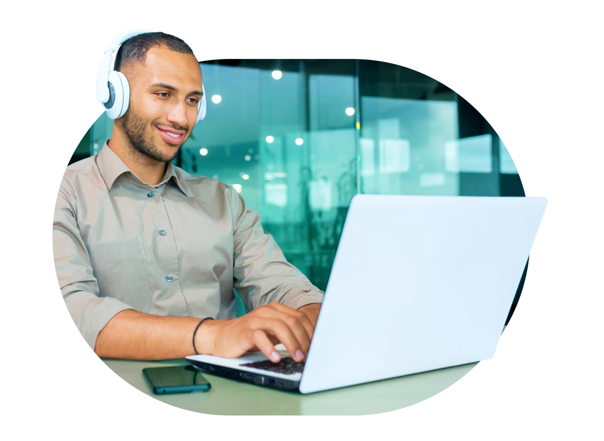 a man in headphones using a laptop