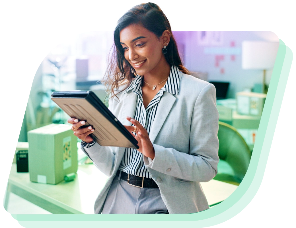 a woman in a suit holding a tablet