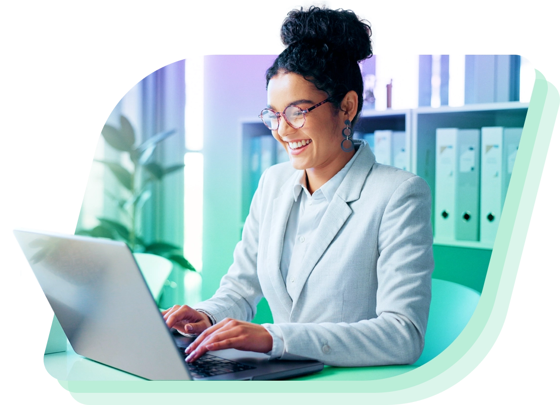 a woman in a suit is using a laptop