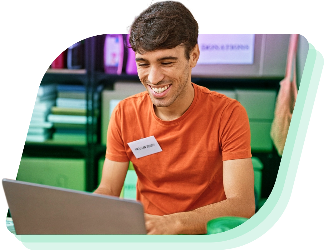 a man sitting at a table with a laptop