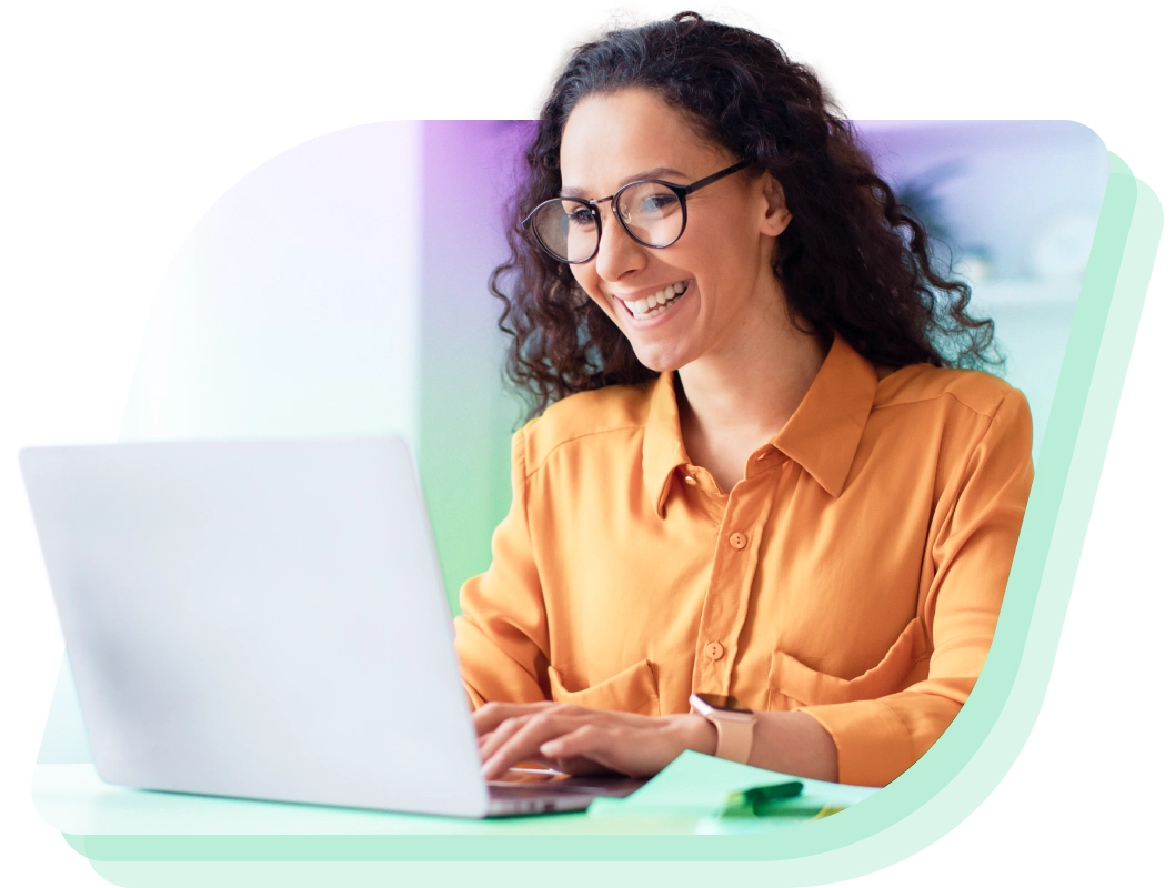 a woman in glasses using a laptop