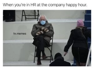 a man in a mask sitting on a chair