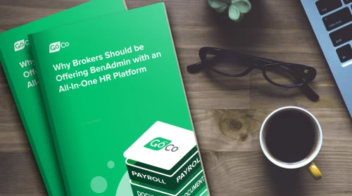 a book with a green cover and a cup of coffee