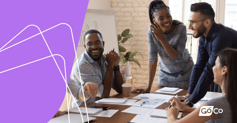 A group of people working around a conference table