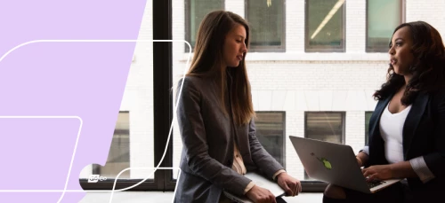 two women talking in an office