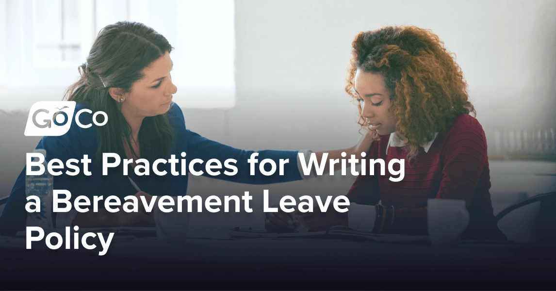 A businesswoman comforts an upset female colleague in an office.