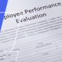 a person signing a paper with the words plove performance evaluation