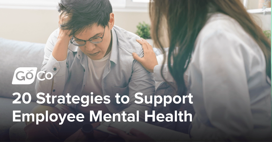 A worried man sitting on a couch being comforted by a woman sitting next to him.