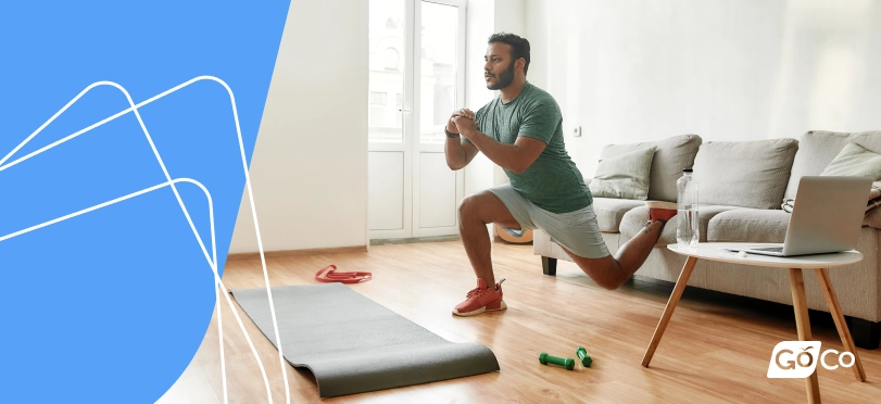 an employee taking a break while working from home to stretch and practice self care