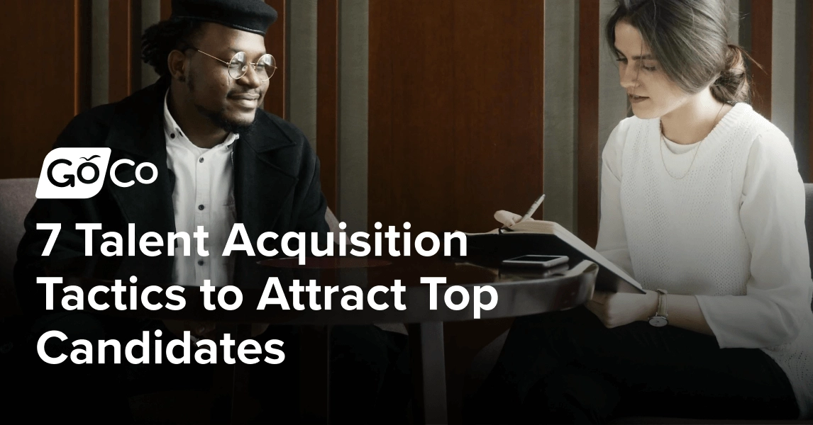 Man in Black Suit Jacket Sitting Beside Woman in White Dress Shirt