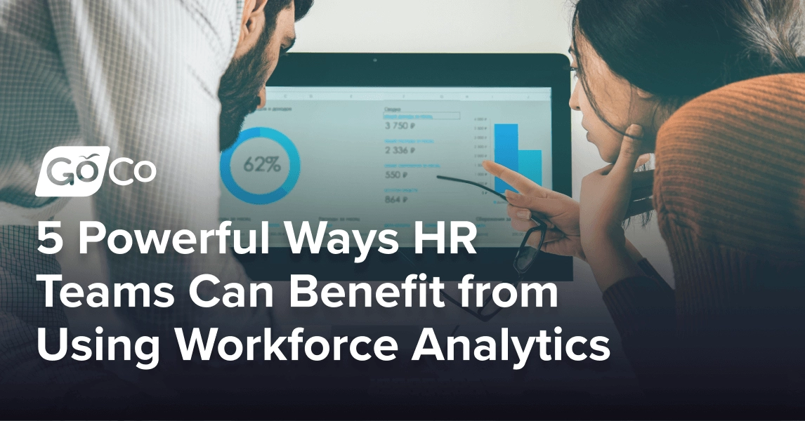 A man and woman closely studying graphs and data on a computer screen.