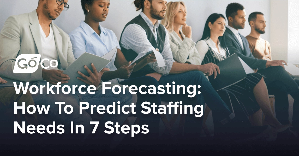 Diverse group of young professionals seated in a row while attending a training or onboarding seminar.