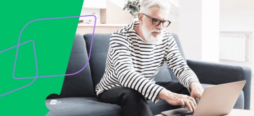 a woman sitting on a couch using a laptop