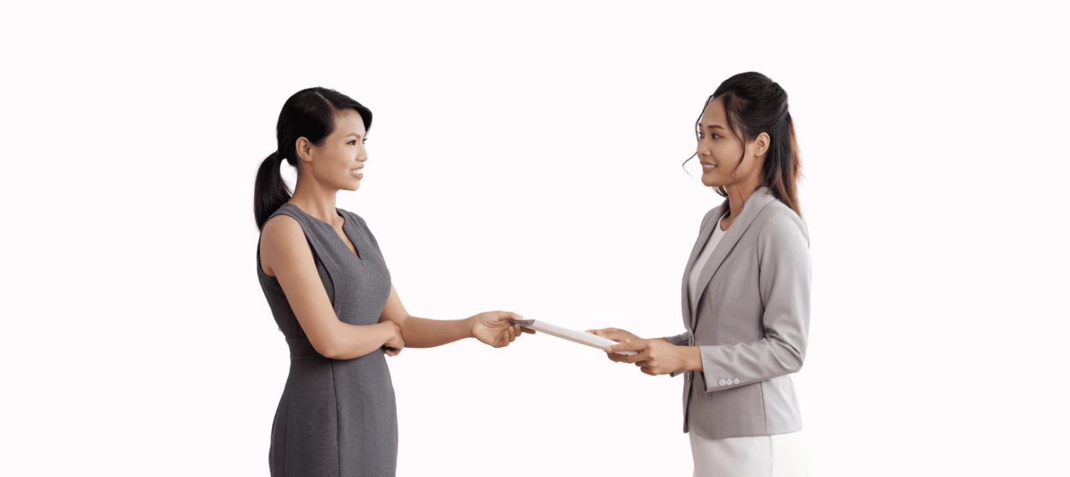 two women shaking hands