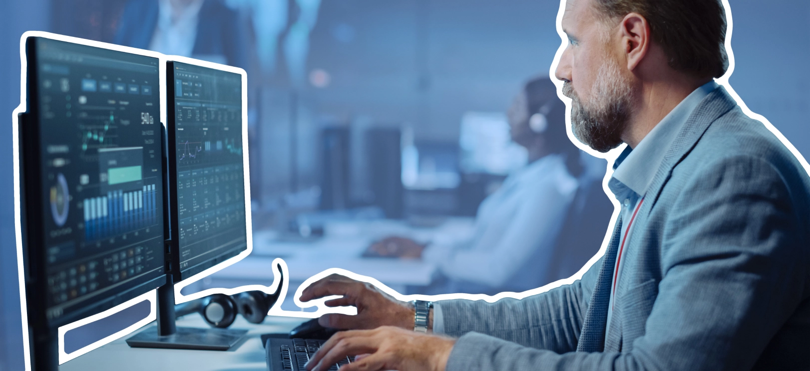 a man in a suit is working on a computer