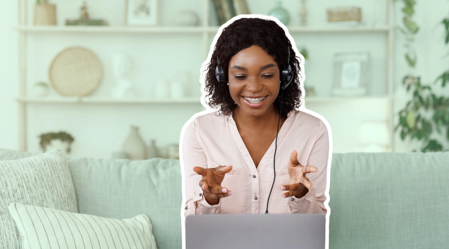 a woman wearing headphones and using a laptop