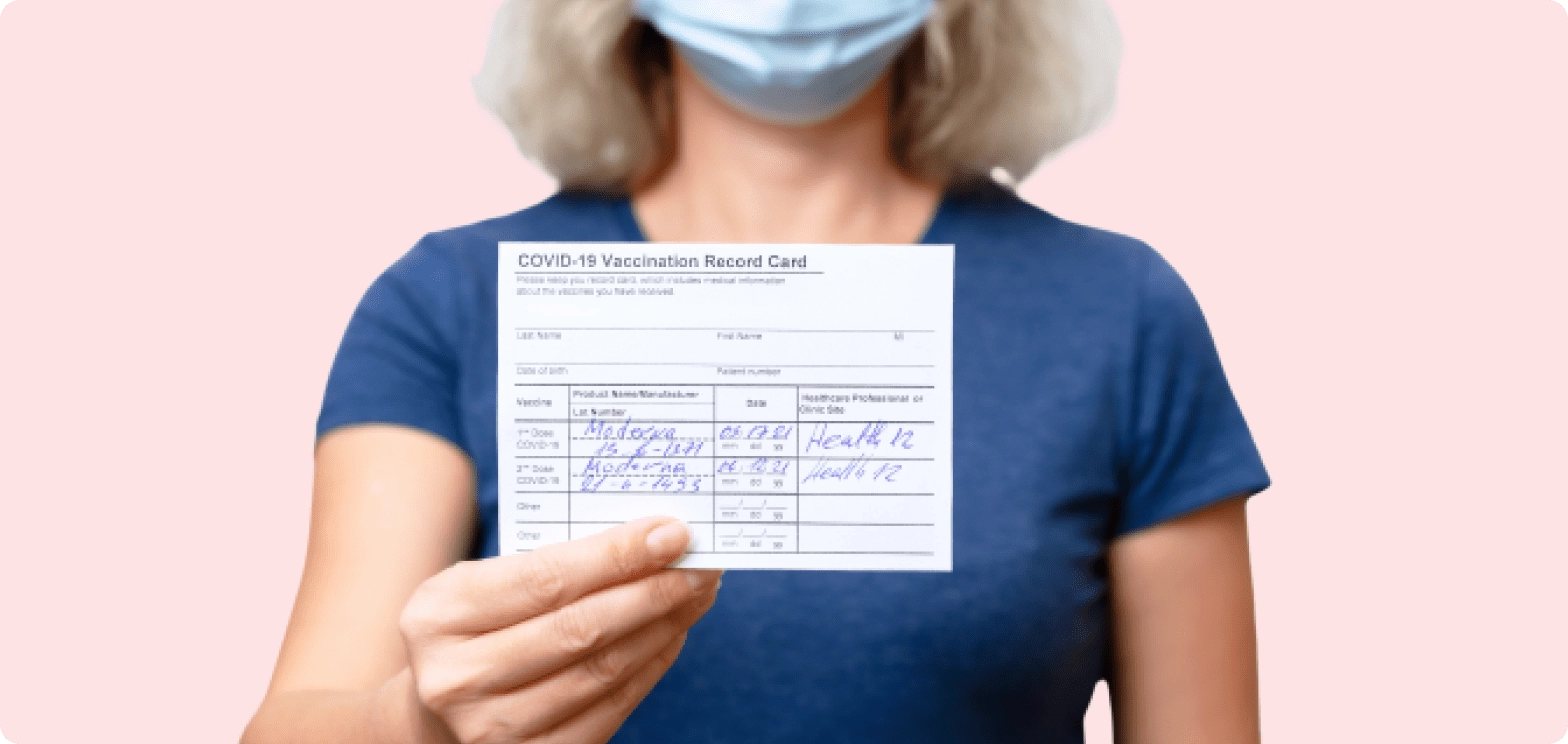 a woman in a blue shirt holding a check