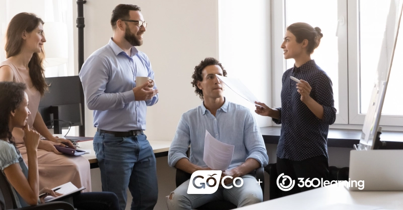 a group of people in an office talking