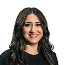 a woman with long hair and a black shirt