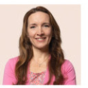 a woman with long hair and a pink shirt